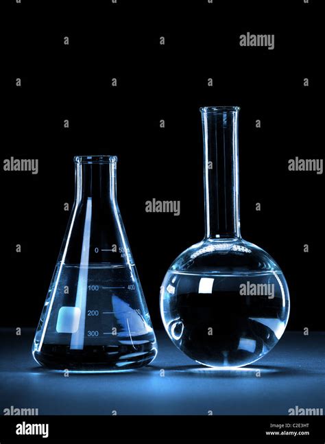 Laboratory Glassware With Blue Light Over Dark Background With