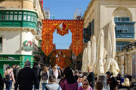 Crowd In Street For Feast Of St Paul S Shipwreck With Colourful Banners