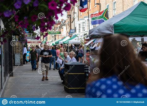 A Scene From A Typical English City High Street With Shoppers Walking