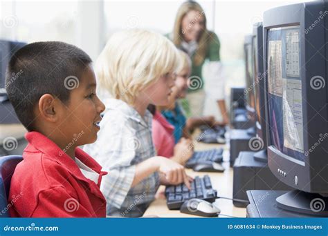 Kindergarten Children Learning To Use Computer Stock Images Image