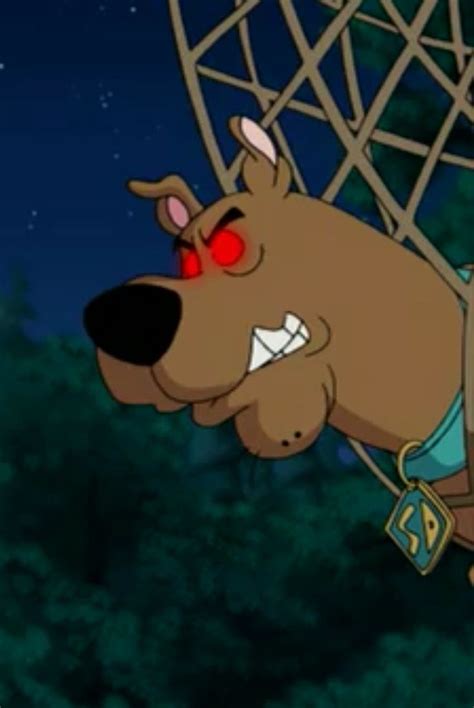 a cartoon dog with red eyes is in the air and has his head stuck into a net