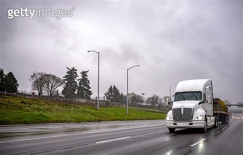 Powerful White Big Rig American Bonnet Semi Truck Transporting Sling