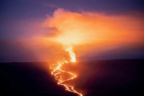 Lava Fountains And Flows Illuminate An Area With A Glow During The