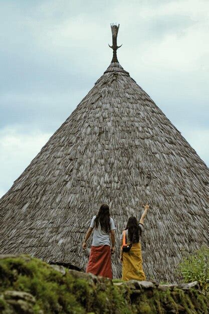 Premium Photo Rear View Of Women Walking Against Sky