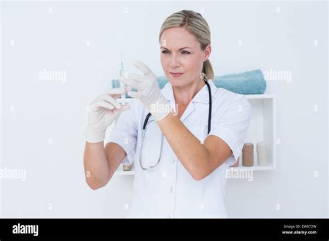 Doctor Preparing Syringe Stock Photo Alamy