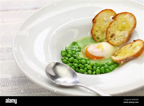 Tear Peas With Poached Egg Spanish Basque Cuisine Stock Photo Alamy