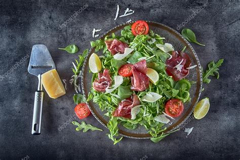 Dried beef bresaola. Salad bresaola arugula baby spinach tomatoes lime ...