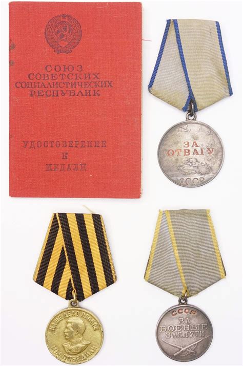 Group of Soviet medals consisting of a Medal for Combat Merit #137694 ...