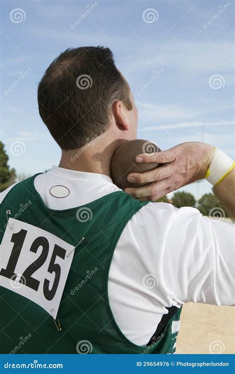 Male Athlete Holding A Shot Put Stock Photo Image Of Adult Metal