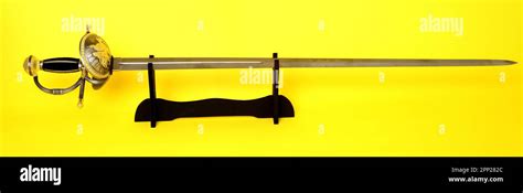 Rapier Sword Guard And Hilt Isolated Over Yellow Stock Photo Alamy