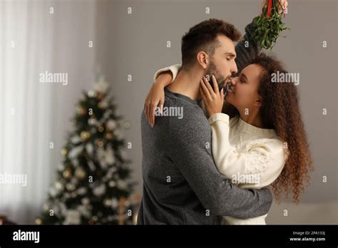 Kissing Under The Mistletoe Portrait Hi Res Stock Photography And