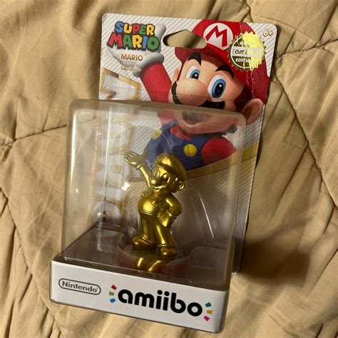 Golden Mario amiibo. A little water damage.... - Depop