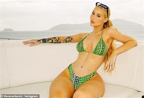 Iggy Azalea Flaunts Her Incredible Curves In A VERY Skimpy Green Bikini