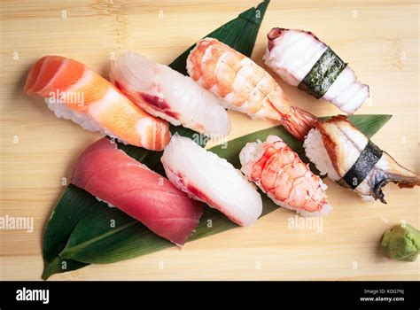 Full Plate Of Sushi And Sashimi In A Japanese Restaurant Stock Photo