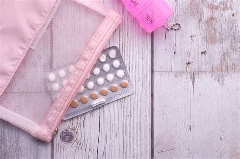 Premium Photo Birth Control Pills On Wooden Background Top View