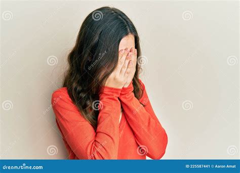 Young Brunette Woman Wearing Casual Clothes With Sad Expression