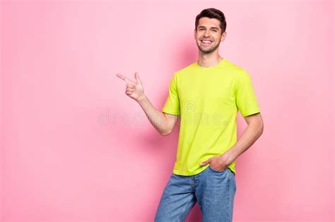 Photo Of Funny Brunet Hairdo Young Guy Point Empty Space Wear Green T