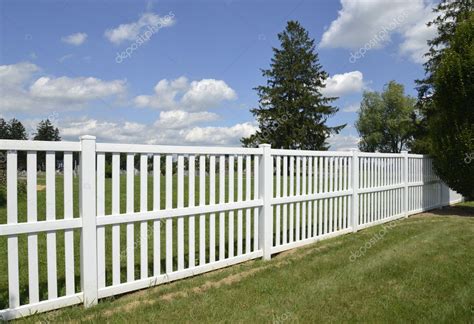 White vinyl fence by green lawn Stock Photo by ©cfarmer 12277191