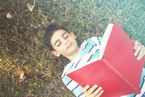 Little Boy Reading Outdoors Stock Image - Image of childhood, concept ...