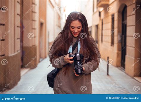 Brunette Girl Looking At Camera And Smiling Stock Image Image Of Camera Photographing 136240031
