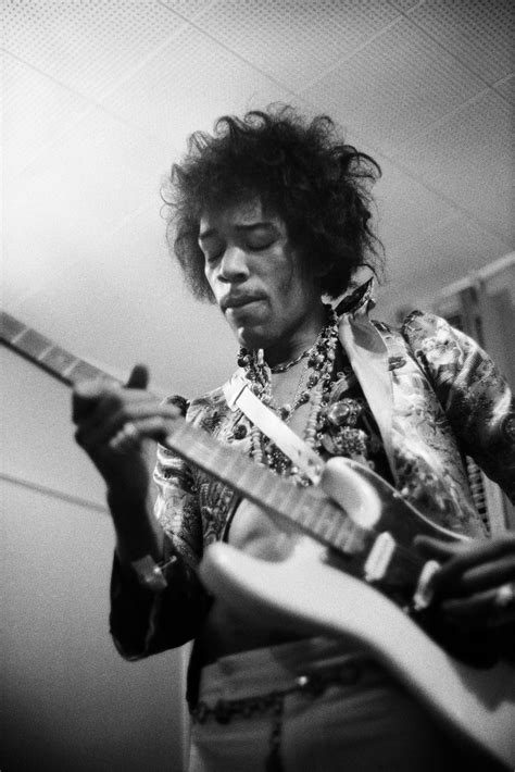 Jimi Hendrix Playing Guitar Smoking