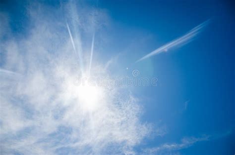 Sun with Lens Flare, on Blue Sky Background. Stock Image - Image of ...