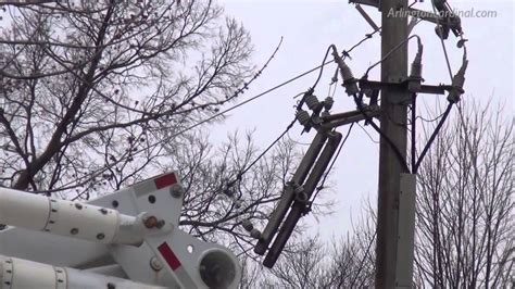 Tree Falls In High Winds Brings Down Power Lines Snaps Poles