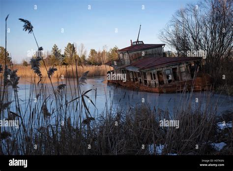 Abandoned Shipwreck On The Banks Of The Pripyat River After The