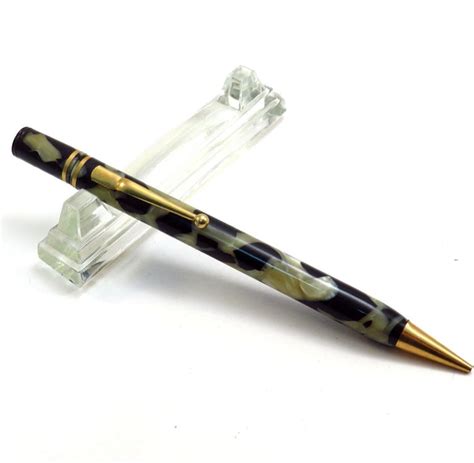 A Pen Sitting On Top Of A Clear Object