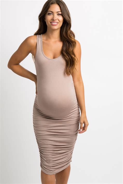 Details A Sleeveless Maternity Bodycon Style Midi Dress Featuring A Solid Hue Ruched Sides For