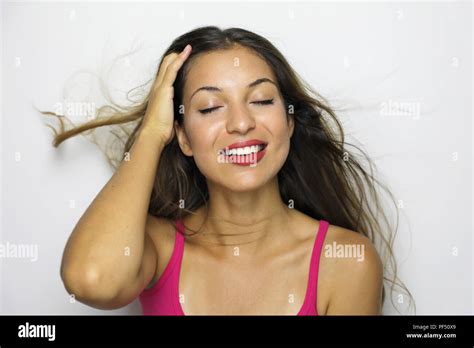 Beautiful Woman Enjoying Wind In Her Face On White Background Stock