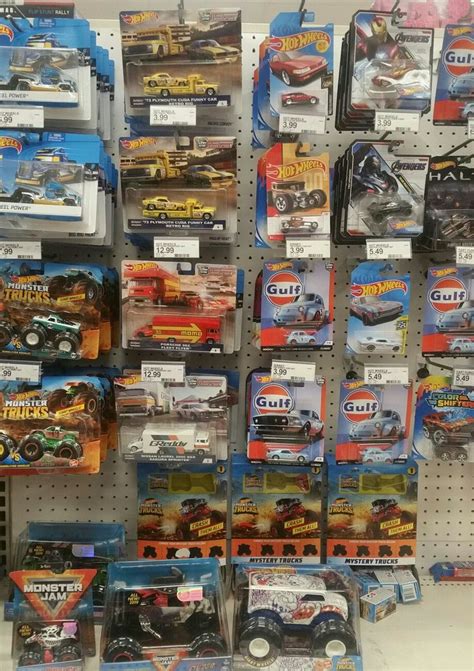 Many Hot Wheels Toys Are On Display In A Toy Store And There Is No Image Here To Provide A