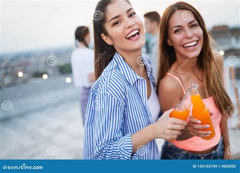 Beautiful Women Friends On The Balcony Having Fun At Party Stock Image