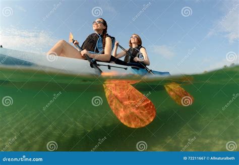 Young Women Smiling While Kayaking In Ocean Stock Image Image Of