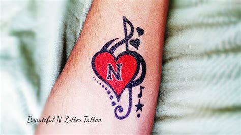 45 Amazing N Letter Tattoo Designs and Ideas - Body Art Guru