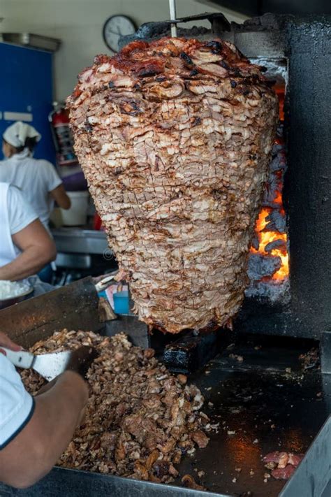 Food Trompo Pastor Tacos Al Pastor Beef Stacked In Sauce With Spices