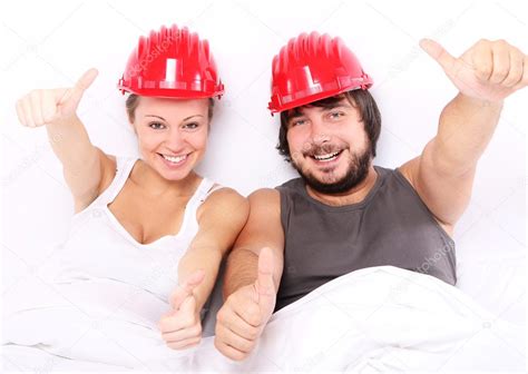 Couple With Hard Hats On Heads Safe Sex Concept Stock Photo