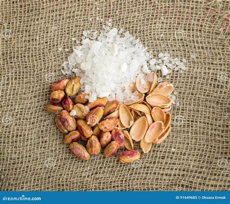 Heap Of Inshell Pistachios And Peeled Pistachios With Large Salt