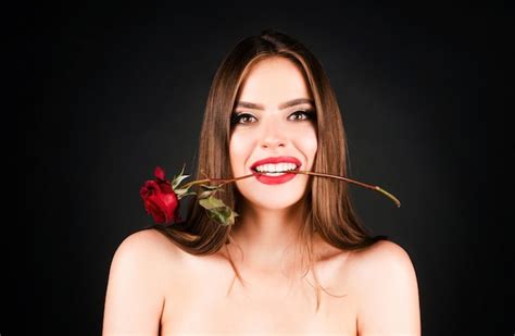 Premium Photo Seductive Sensual Woman Holding Red Rose With Teeth