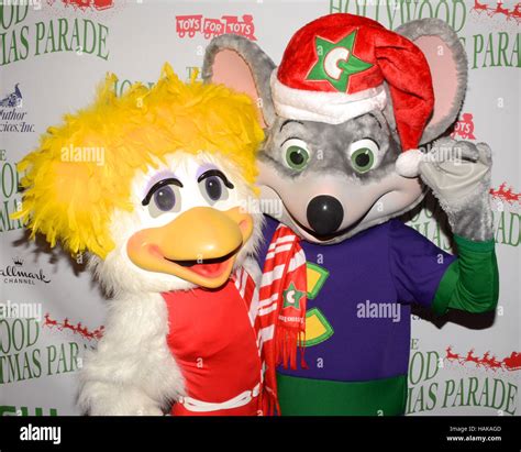 Chuck E Cheese and Helen Henny arrives at the 85th Annual Hollywood Christmas Parade in ...