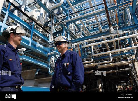 Oil And Gas Workers Inside Refinery Indiustry Stock Photo Alamy