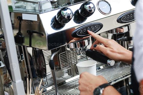 Barista making coffee using professional espresso machine 14354103 Stock Photo at Vecteezy