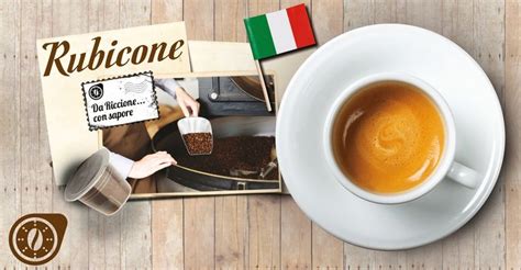 A Cup Of Coffee Next To A Postcard With The Italian Word Rubicone On It