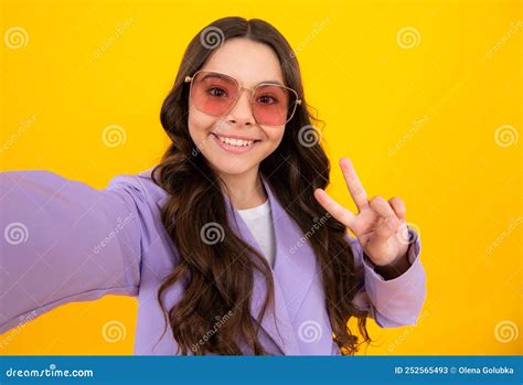 Fashion Teen Girl In Trendy Wear Making Selfie Posing On Yellow Background Fashion Teenager