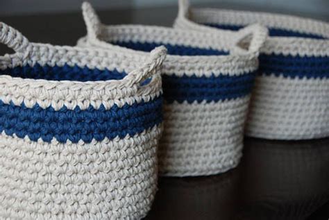 Three Blue And White Baskets Sitting On Top Of A Table