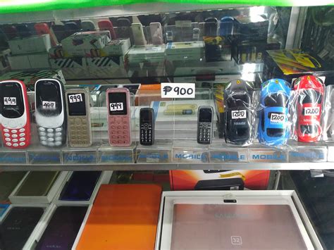 Saw these two tiny phones on sale. Nearly the size of my thumb. They're