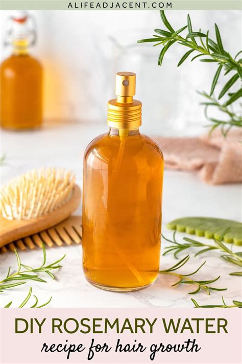 A Bottle Of Rosemary Water Next To A Brush On A White Counter Top With