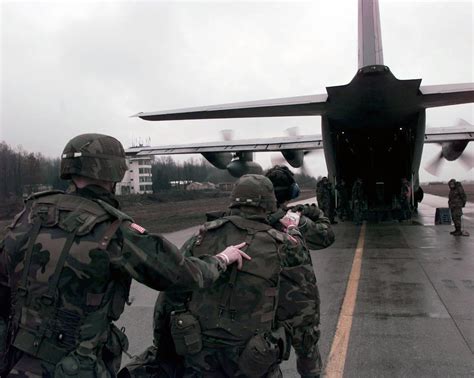 Patients Walk In File Towards A C 130 Hercules Air Transport At Tuzla