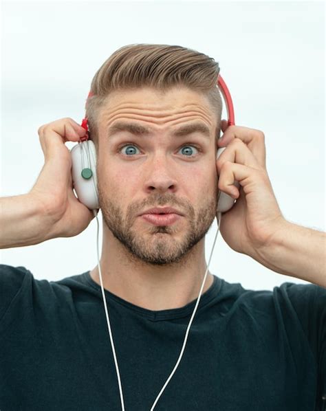 Premium Photo Excited Man Listening Music In Headphones Emotional