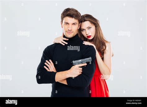 Portrait Of Beautiful Stylish Young Couple With Gun Stock Photo Alamy